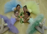 thumbnail image of 4 ballerinas after a recital.